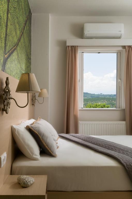 Łóżko lub łóżka w pokoju w obiekcie Majestic Villa