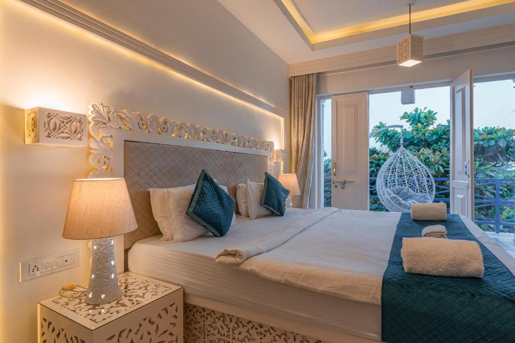 Postel nebo postele na pokoji v ubytování Lillywoods Zac Beach Resort, Calangute