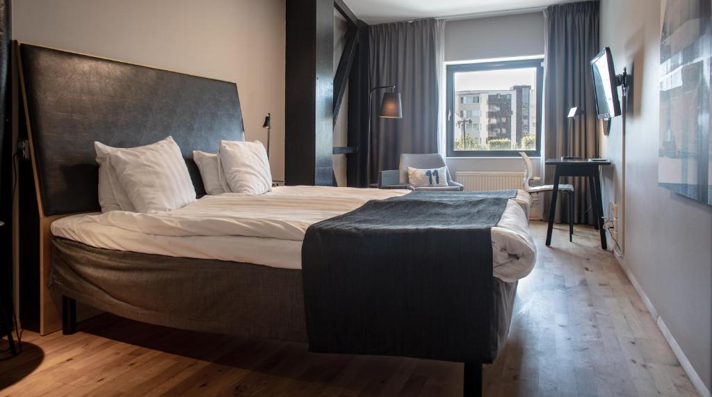 Postel nebo postele na pokoji v ubytování Quality Hotel 11 & Eriksbergshallen