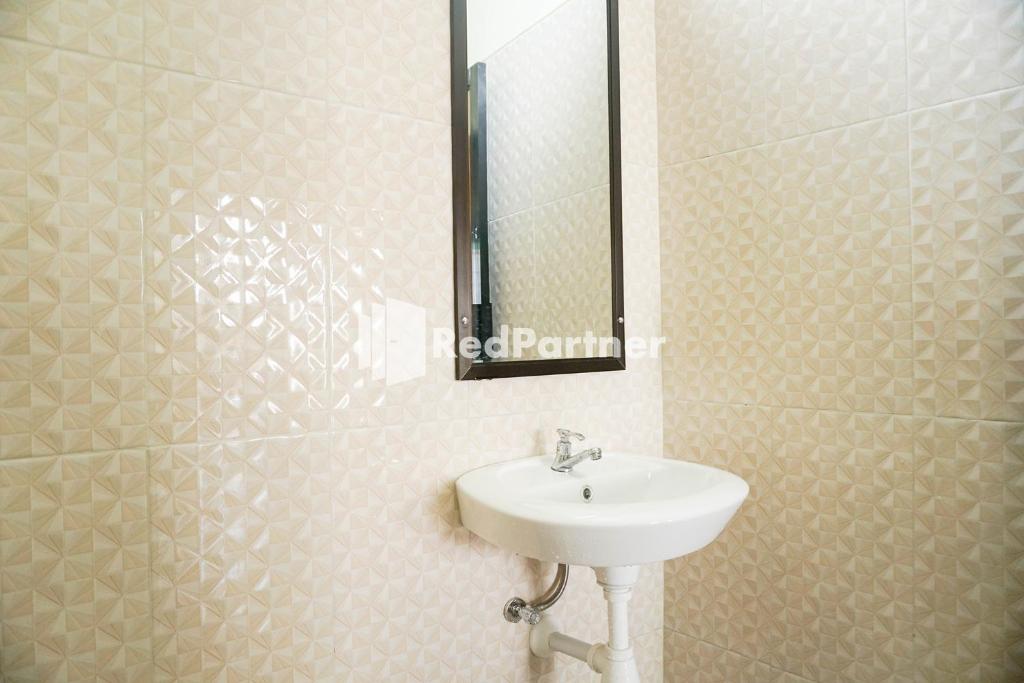 Koupelna v ubytování Griya Imafa Inn RedPartner near Jatim Park 2
