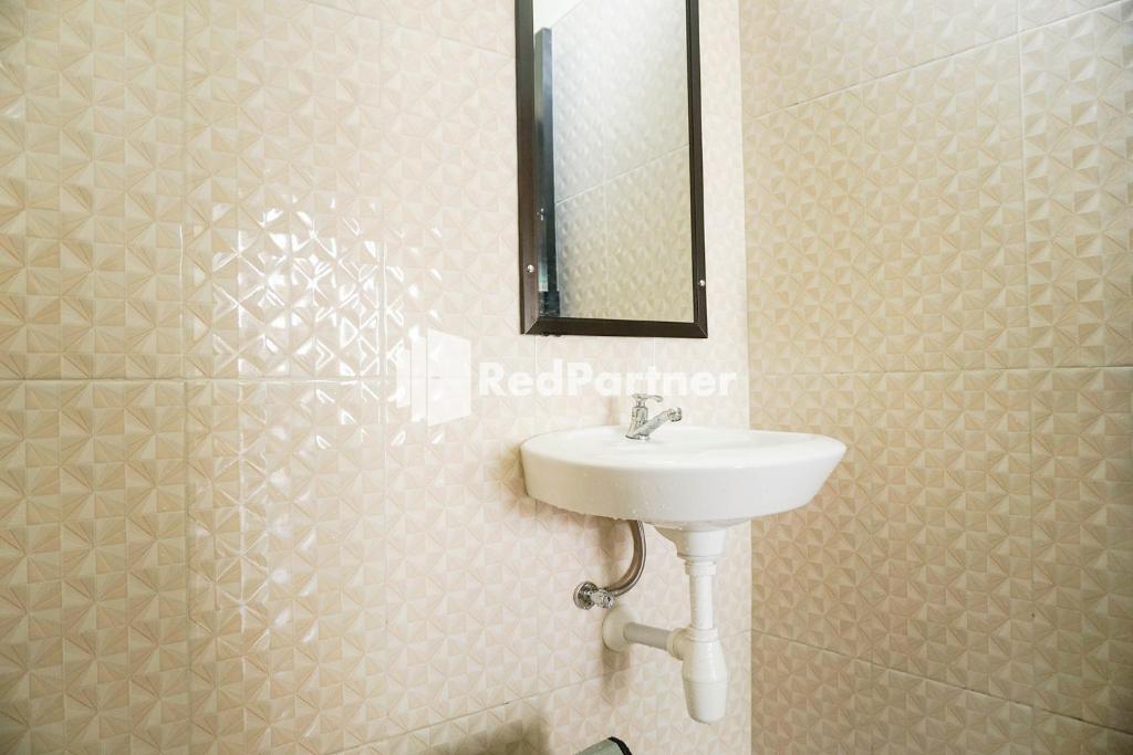 Koupelna v ubytování Griya Imafa Inn RedPartner near Jatim Park 2