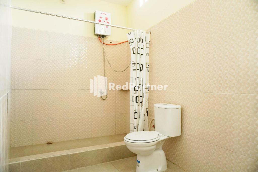 Koupelna v ubytování Griya Imafa Inn RedPartner near Jatim Park 2