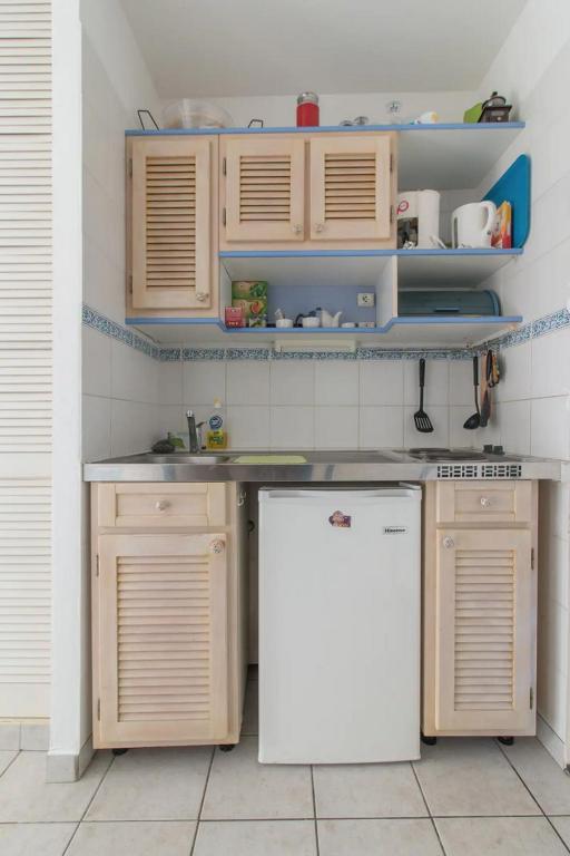 Kuchyň nebo kuchyňský kout v ubytování Un pied-à-terre face à la marina