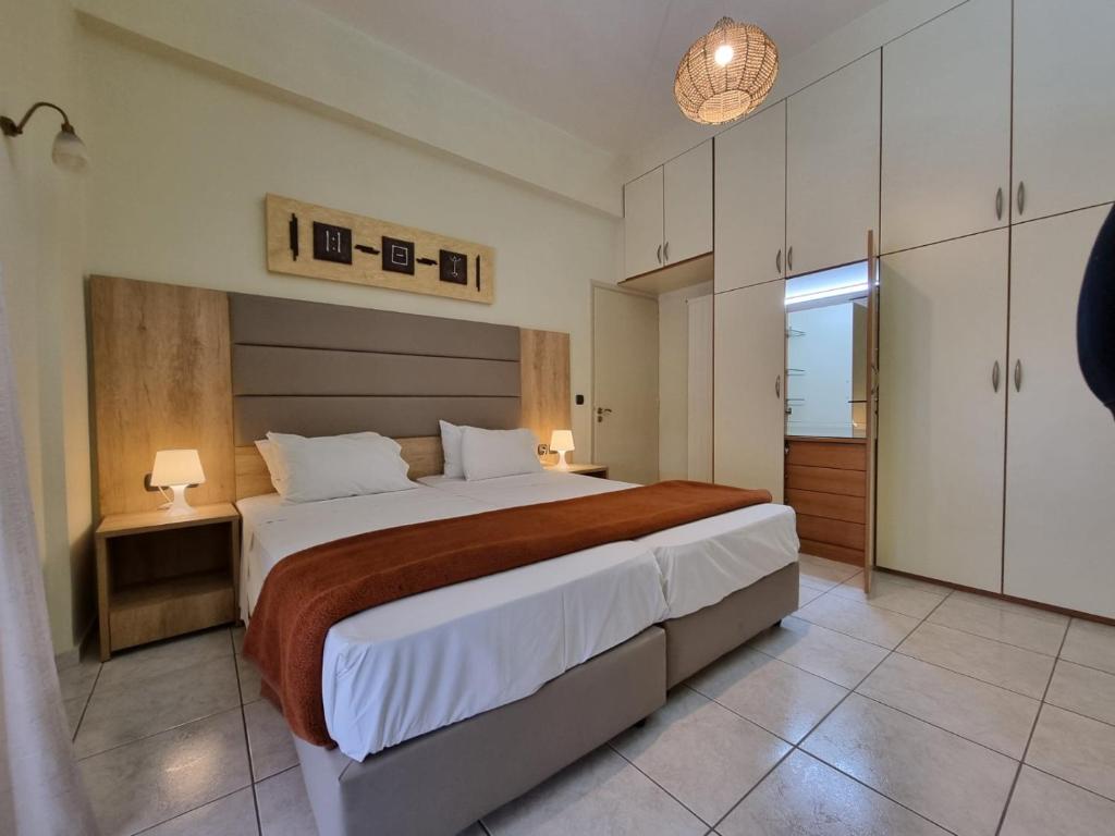 a bedroom with a large bed in a room at Casa Centrale in Heraklio Town