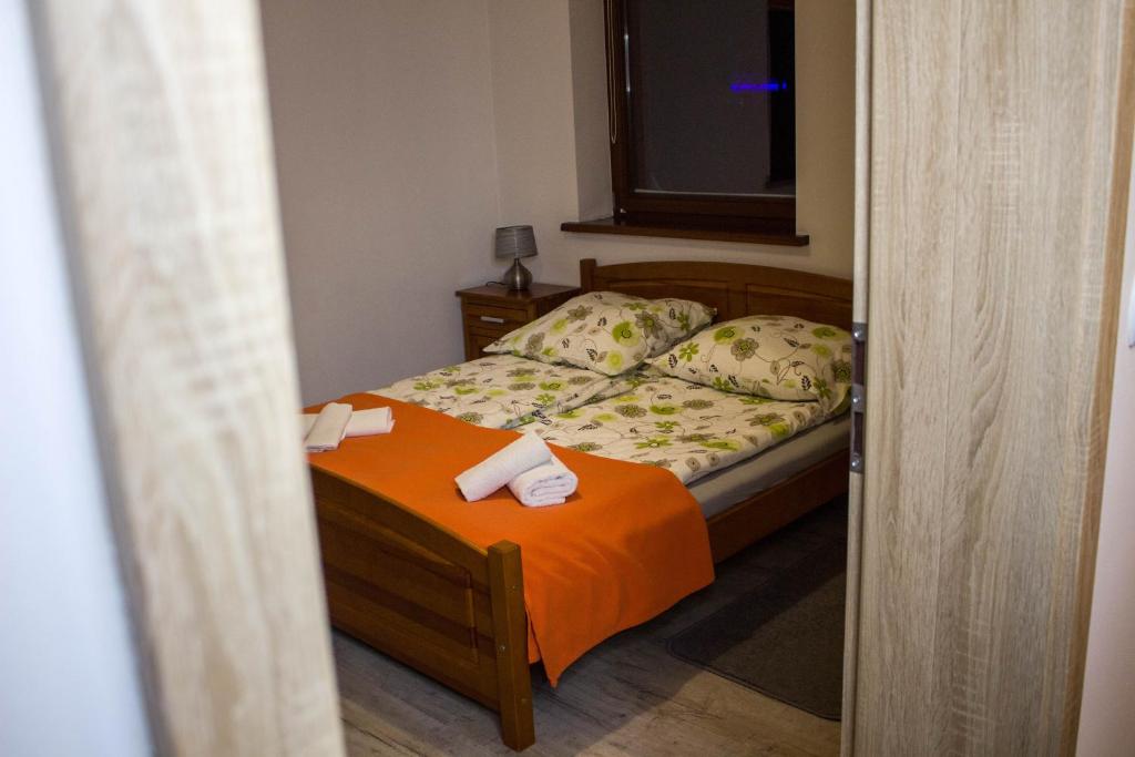 Posteľ alebo postele v izbe v ubytovaní Apartament Słoneczny Koscielisko