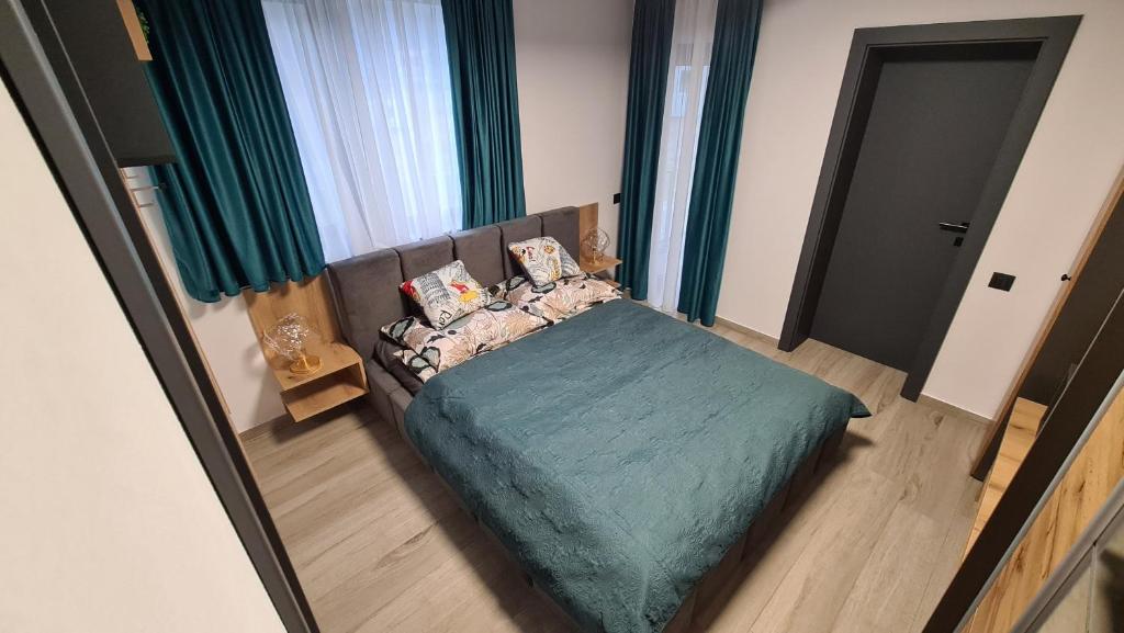 Postel nebo postele na pokoji v ubytování Complex Lunlo Village