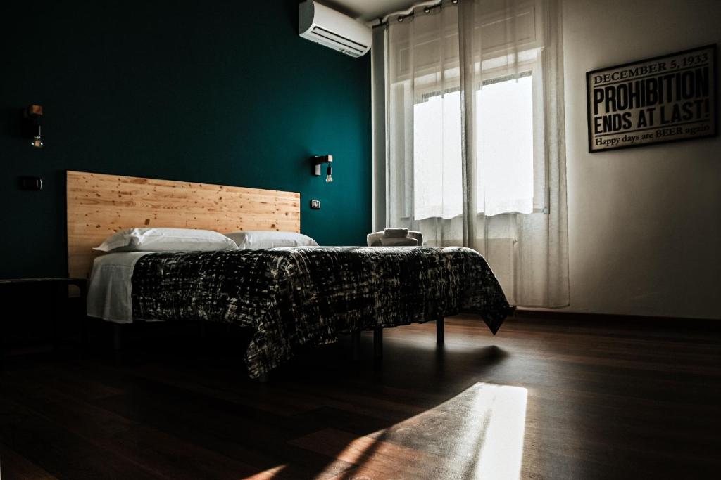 A bed or beds in a room at Travel B&B