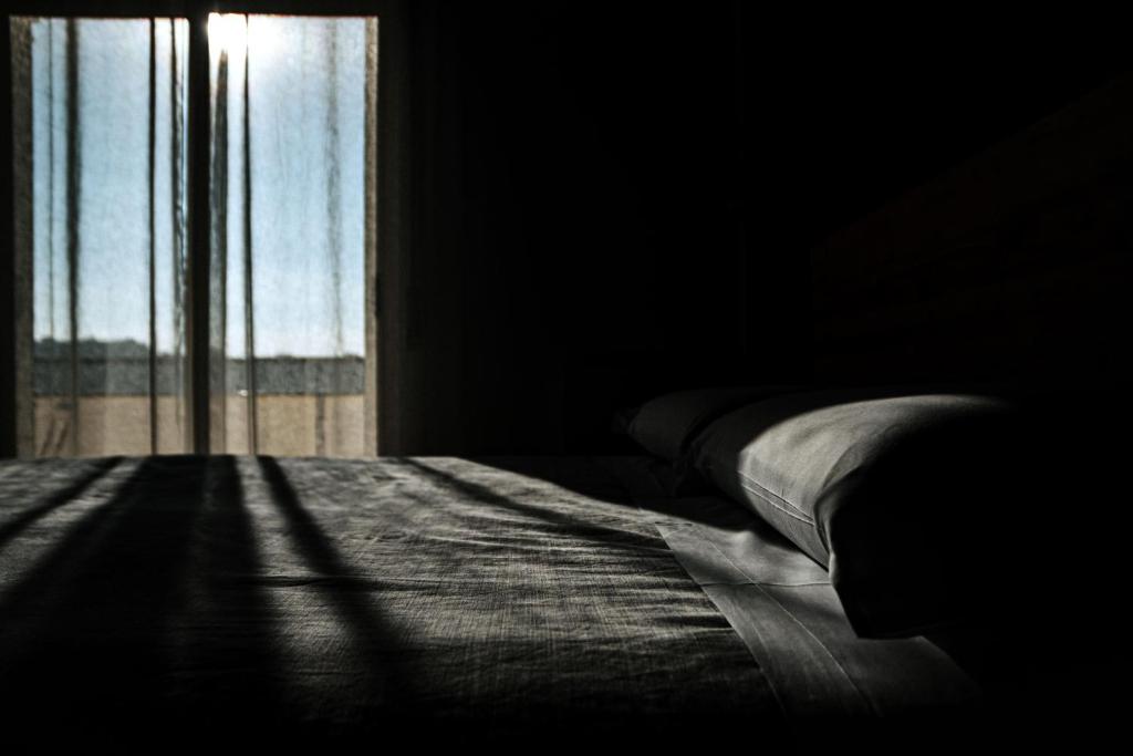 A bed or beds in a room at Travel B&B