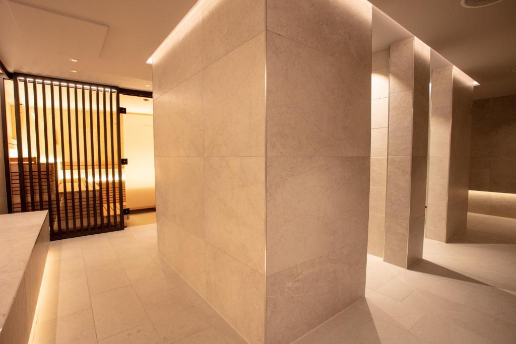 Postel nebo postele na pokoji v ubytování Posthotel Valbella