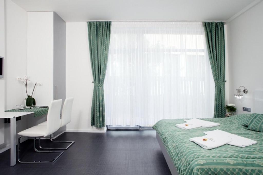 Postel nebo postele na pokoji v ubytování Hotel U Karla