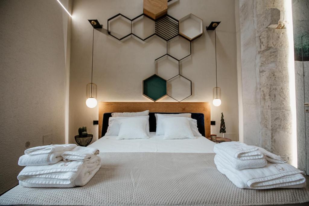 Postel nebo postele na pokoji v ubytování FICOPALA SUITES
