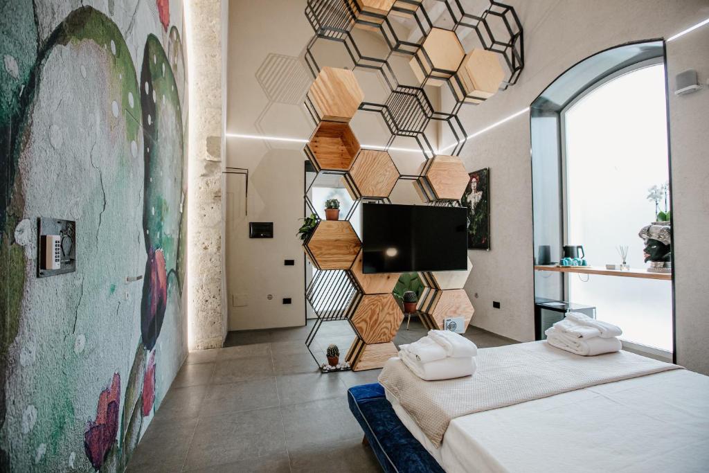 Postel nebo postele na pokoji v ubytování FICOPALA SUITES