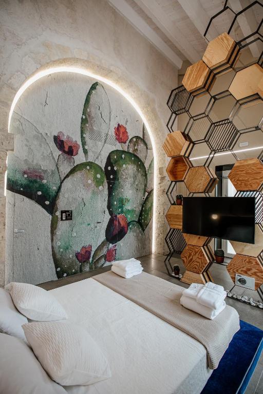 Postel nebo postele na pokoji v ubytování FICOPALA SUITES