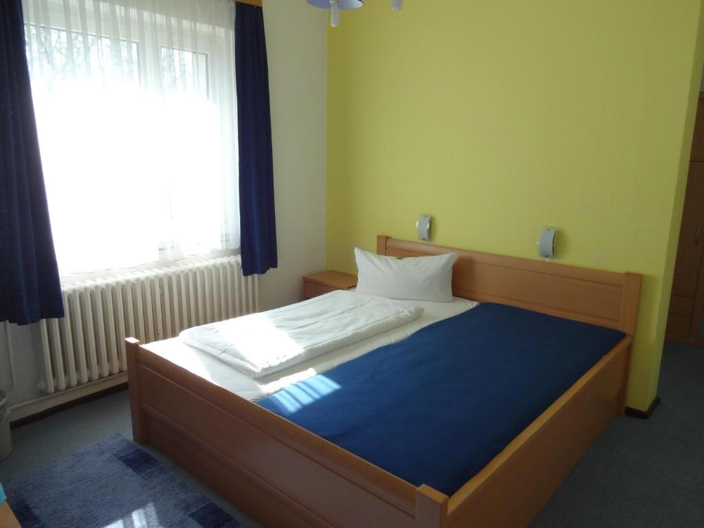 Postel nebo postele na pokoji v ubytování Hotel Süden
