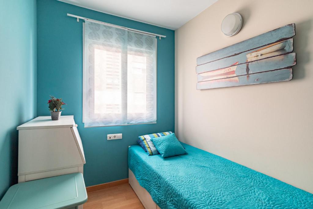 Posteľ alebo postele v izbe v ubytovaní FORUM BEACH 2 AND POOL APARTMENT BARCELONA
