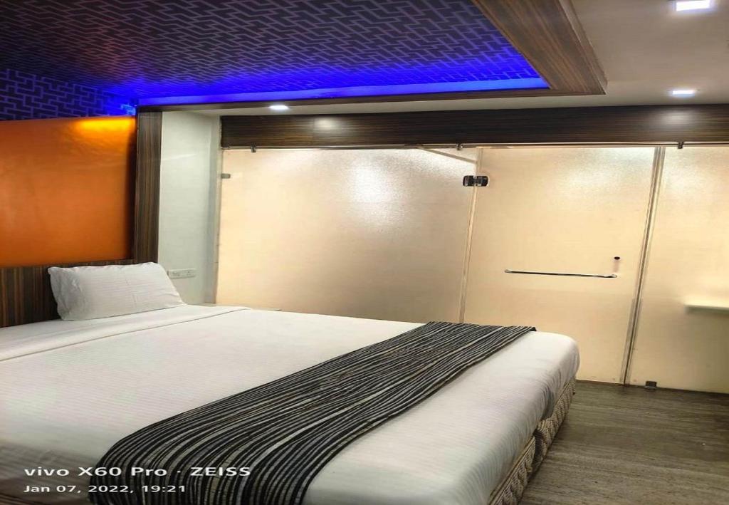 Postel nebo postele na pokoji v ubytování Hotel M Grand