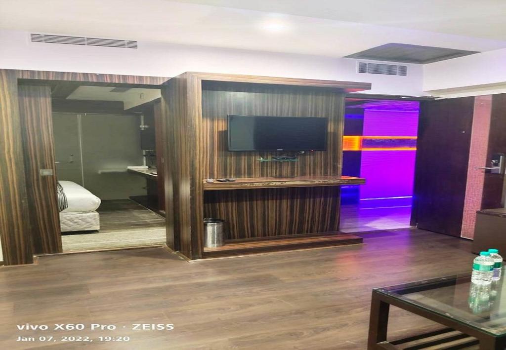 TV a/nebo společenská místnost v ubytování Hotel M Grand