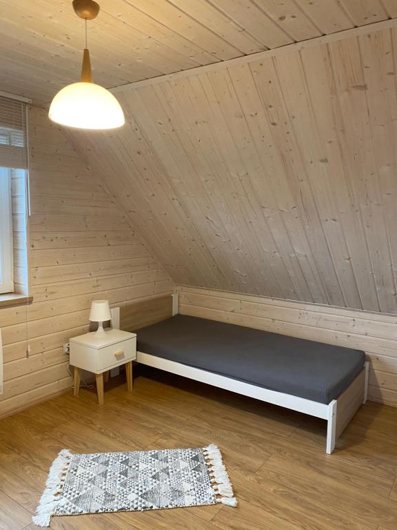 Posteľ alebo postele v izbe v ubytovaní Domek Całoroczny Fuleda -Mazury Giżycko Sauna Jacuzii Kominek