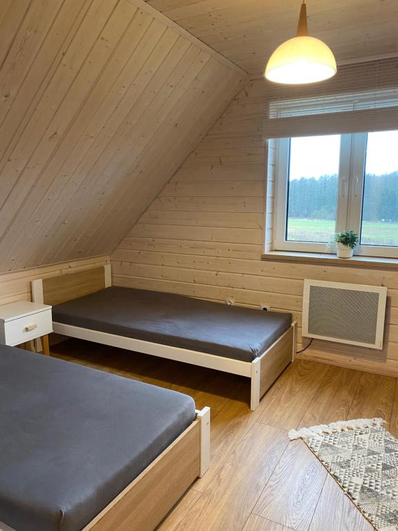 Posteľ alebo postele v izbe v ubytovaní Domek Całoroczny Fuleda -Mazury Giżycko Sauna Jacuzii Kominek