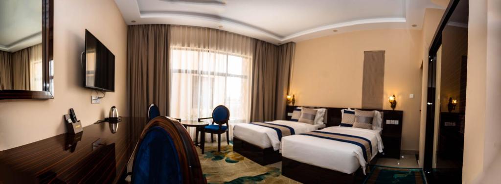 Postel nebo postele na pokoji v ubytování Asmara Hotel