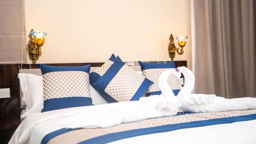 Postel nebo postele na pokoji v ubytování Asmara Hotel