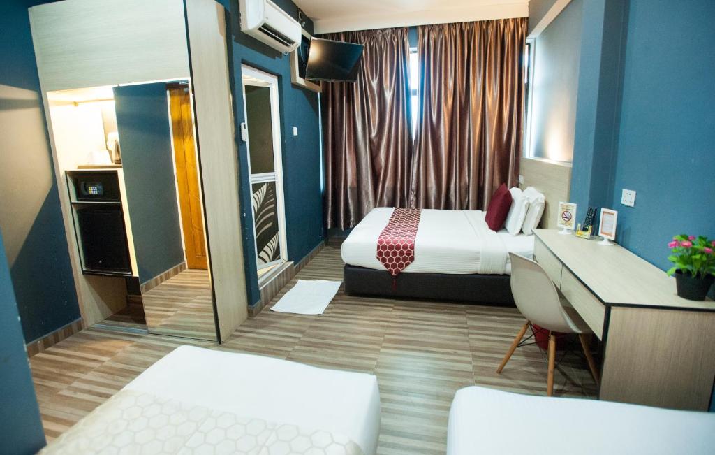 Postel nebo postele na pokoji v ubytování DJ Citi Inn Premier