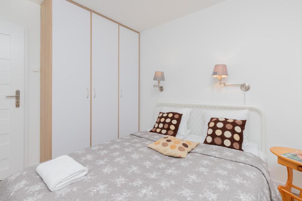 Posteľ alebo postele v izbe v ubytovaní City Center Apartment Gdynia by Noclegi Renters