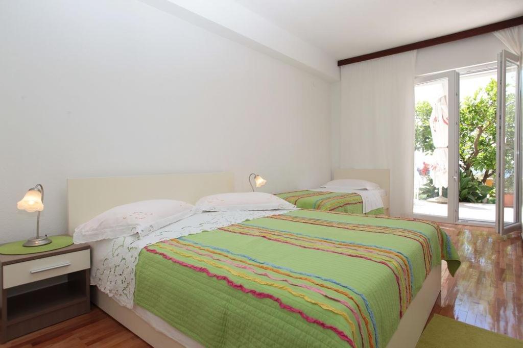 Posteľ alebo postele v izbe v ubytovaní Apartment in Podgora with sea view, terrace, air conditioning, WiFi 849-2