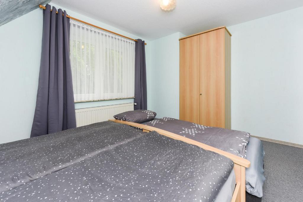 Postel nebo postele na pokoji v ubytování Ferienhaus Elfriede Coordes