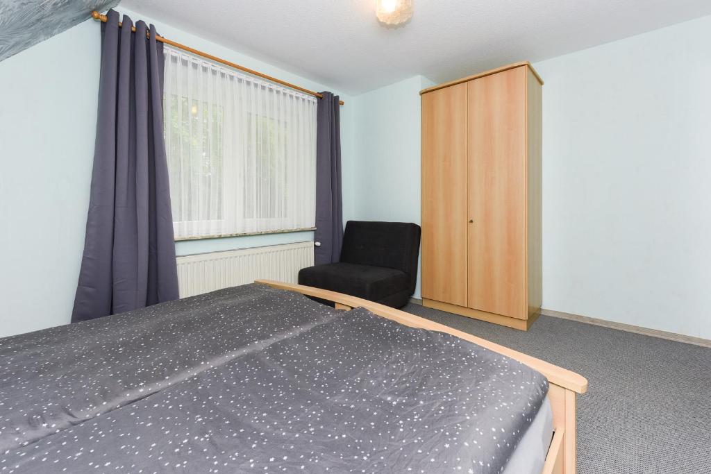 Postel nebo postele na pokoji v ubytování Ferienhaus Elfriede Coordes