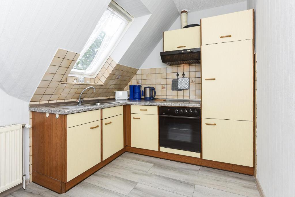 Kuchyň nebo kuchyňský kout v ubytování Ferienhaus Elfriede Coordes