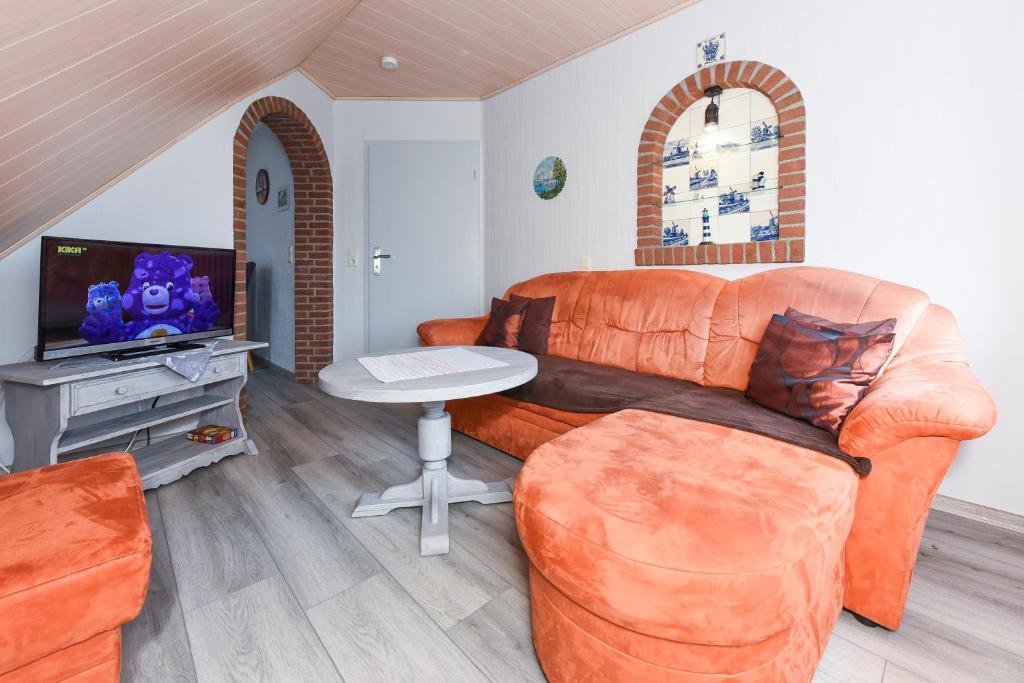 TV a/nebo společenská místnost v ubytování Ferienhaus Elfriede Coordes
