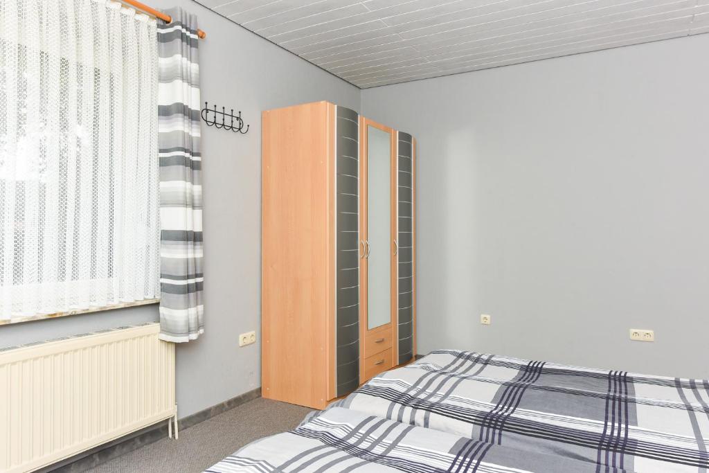 Postel nebo postele na pokoji v ubytování Ferienhaus Elfriede Coordes