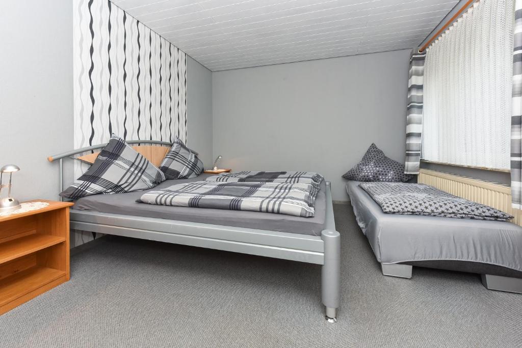 Postel nebo postele na pokoji v ubytování Ferienhaus Elfriede Coordes