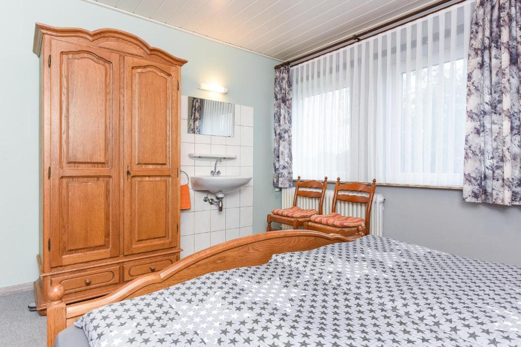 Postel nebo postele na pokoji v ubytování Ferienhaus Elfriede Coordes