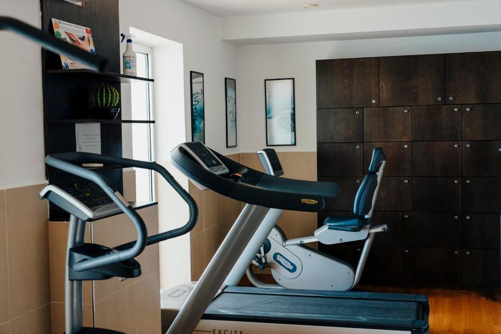 a gym with a treadmill in a room at Hotel Cetus in Cetara