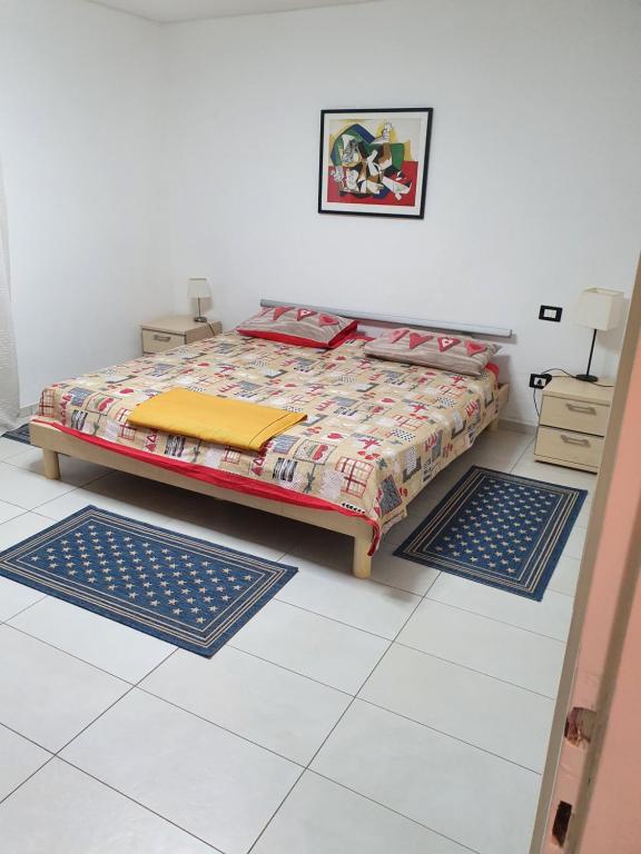 a bedroom with a bed with two mats on the floor at Villa Monica in Luino