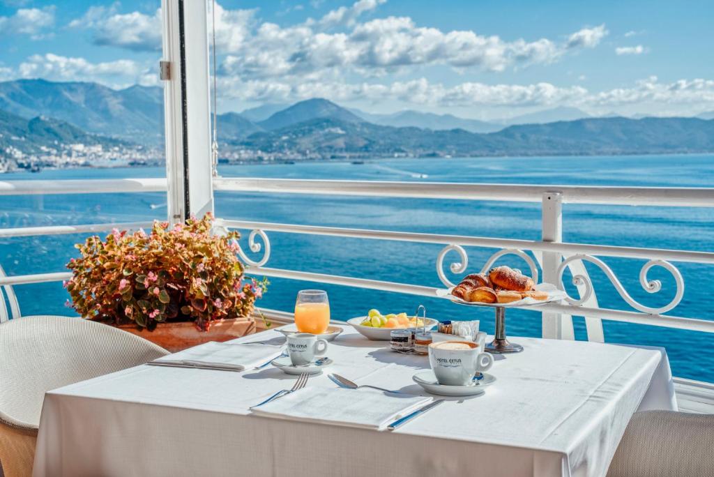 a table with a plate of food on a cruise ship at Hotel Cetus in Cetara