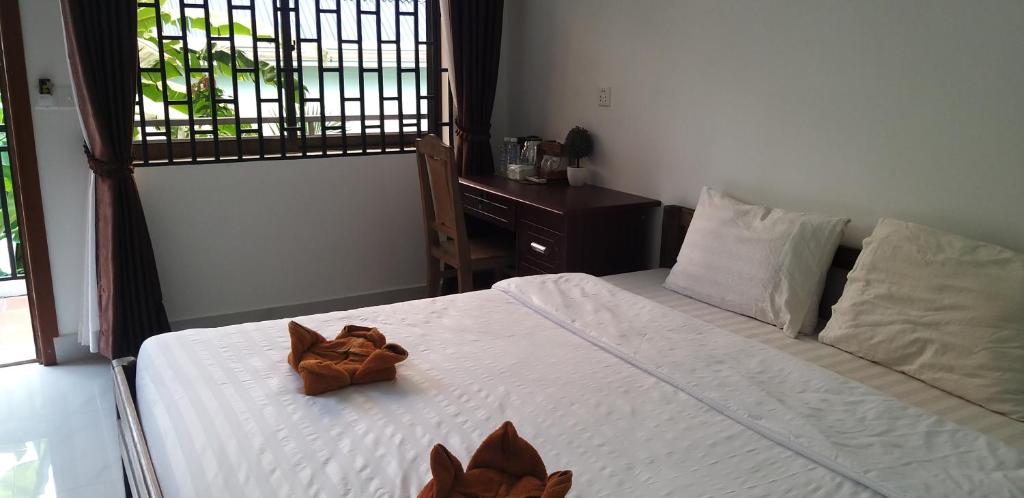 Postel nebo postele na pokoji v ubytování Khmer House Guesthouse