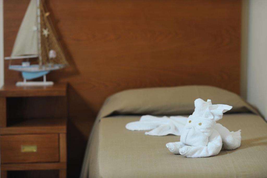 Postel nebo postele na pokoji v ubytování Hotel Tropis