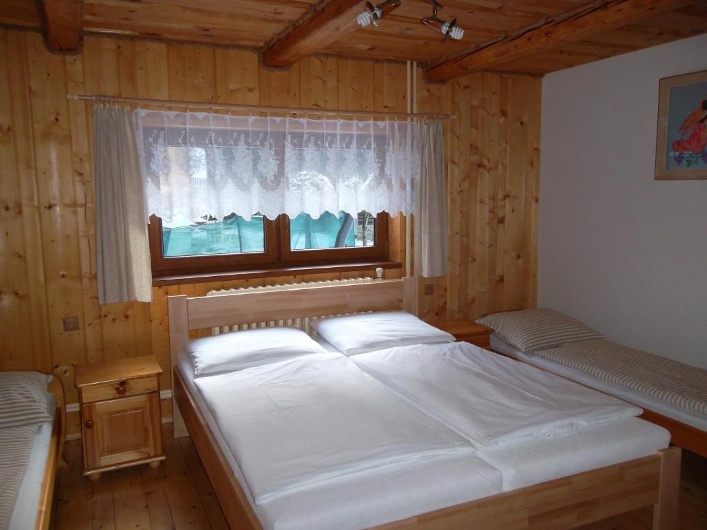 Postel nebo postele na pokoji v ubytování Chata Sipkova I