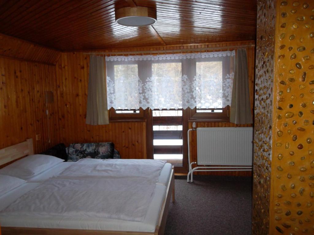 Postel nebo postele na pokoji v ubytování Chata Sipkova I