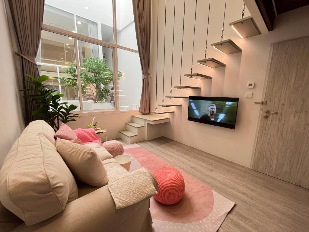 TV a/nebo společenská místnost v ubytování Ease Me Residence