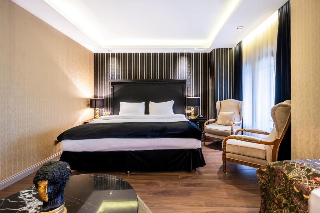 Postel nebo postele na pokoji v ubytování Golden Gate Hotel Topkapı