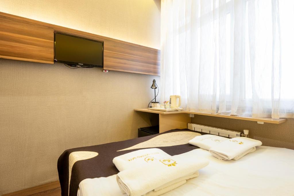 Postel nebo postele na pokoji v ubytování Golden Gate Hotel Topkapı