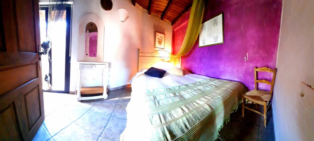 A bed or beds in a room at La Dueña I