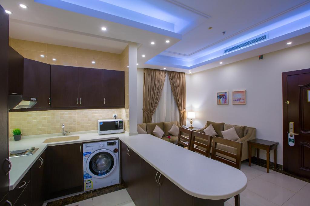 Kuchyň nebo kuchyňský kout v ubytování Sun Park Hotel Suites