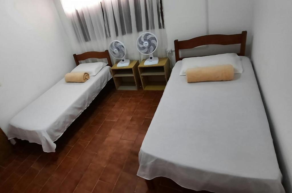 Postel nebo postele na pokoji v ubytování Hostel Universo