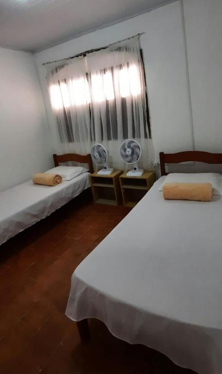 Postel nebo postele na pokoji v ubytování Hostel Universo