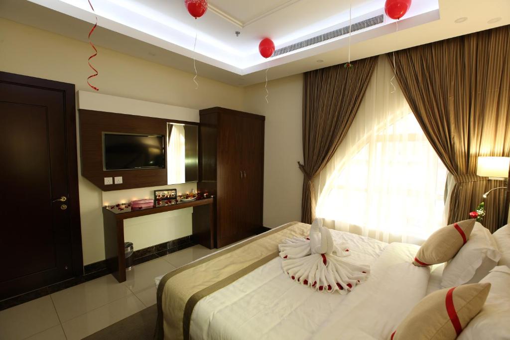 Postel nebo postele na pokoji v ubytování Sun Park Hotel Suites